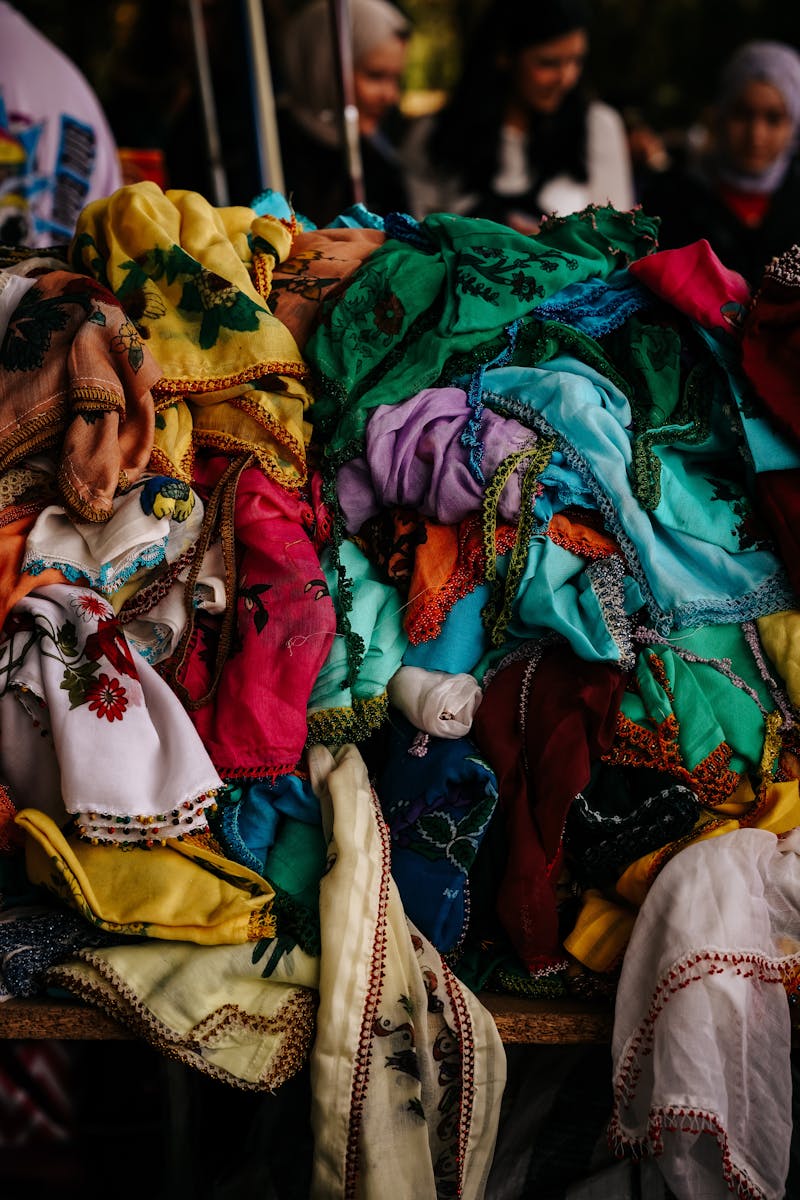 Vibrant assortment of scarves displayed at a market stall in Ankara, Türkiye.